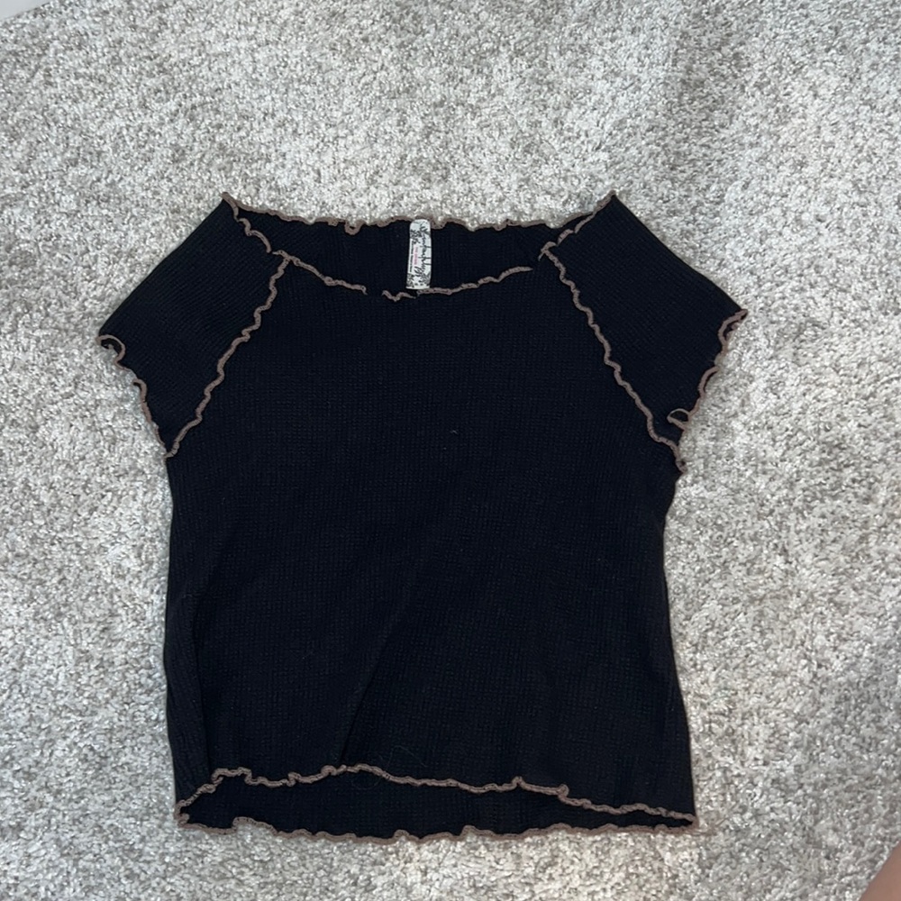 Free people black robbed top with pink scalloped trim.